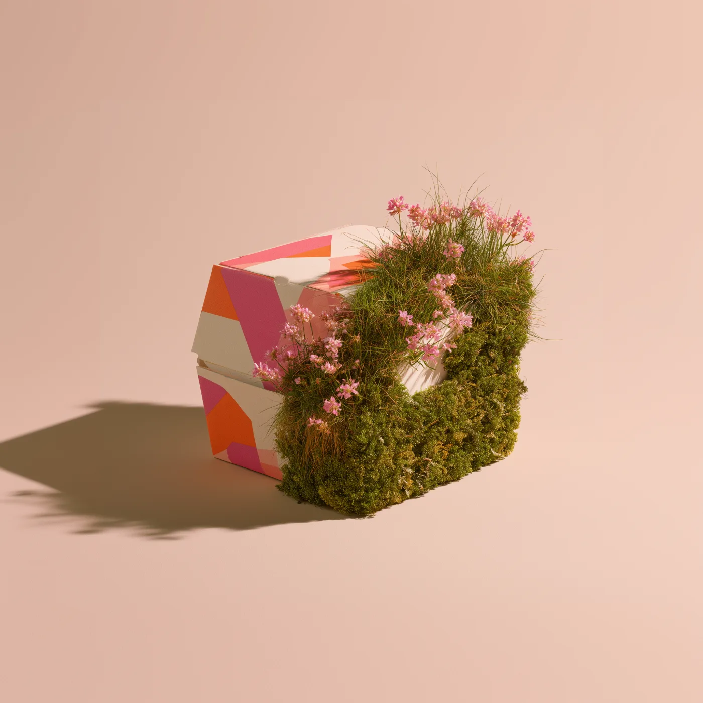 Bedruckte Foodbox, aus der Moos und rosa Blüten wachsen